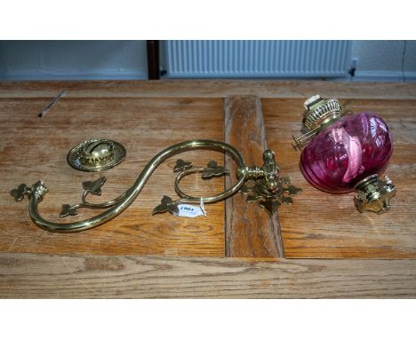 An Antique Brass Gasolier Wall Fitting converted into a ruby font with funnel. Measuring 19 inches wide and overall height 12