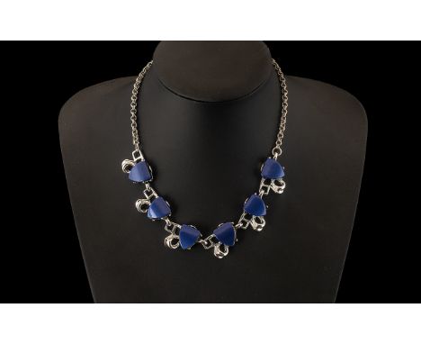 Lisner Elaborate Vintage Design Necklace in blue lucite shapes, set into shaped silver plated geometric design, suspended fro