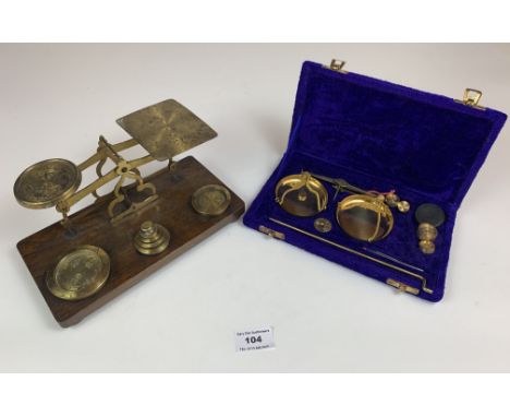 Cased set of hanging scales, and a postal scale and weights