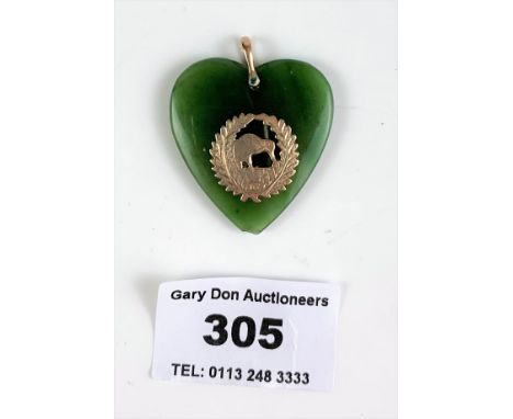 Jade heart pendant with 9k gold emblem, length 1.5”
