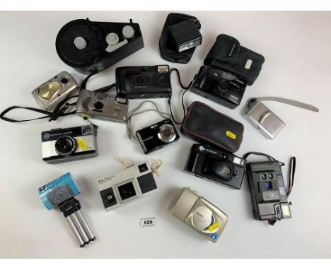 11 instamatic and digital cameras – 3 Olympus, 2 Kodak, 2 Halina, 1 Oshima, 1 Fotorama, 1 Fujifilm, 1 Premier, tripod, light 