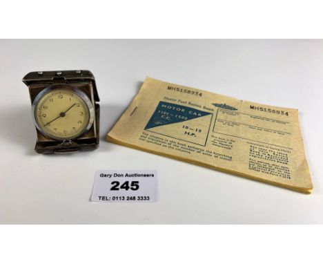 Miniature plated travel clock 1.75” x 1.5”, not running. And Motor Fuel Ration Book