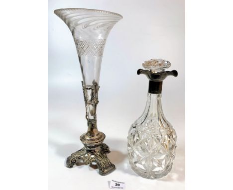 Silver topped glass decanter 11” high (crack in body) and glass trumpet vase in plated holder 14” high.