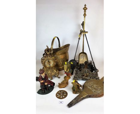 Quantity of brassware including clock, fire irons, coal bucket, bellows,  goblet, triangular stand, metal figure doorstop and