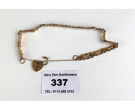 9k gold gate bracelet with heart lock, length 7”, w: 3.5 gms