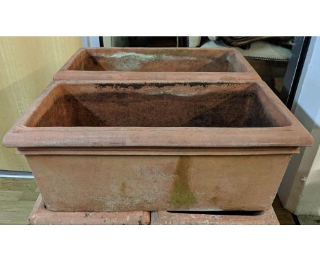 TROUGH PLANTERS, a pair, 76cm x 50cm x 33cm, terracotta, each with loose claw feet. (2) 