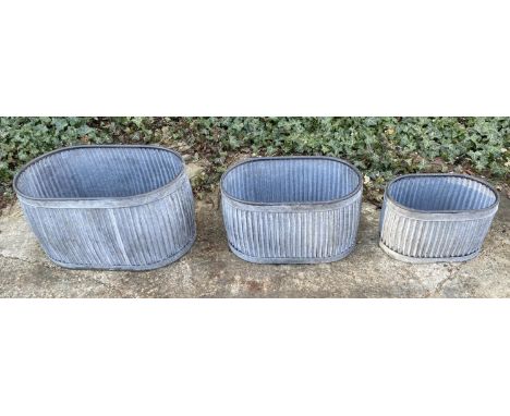 TROUGH PLANTERS, a graduated set of 3, galvanised, ribbed design, 35x64x40 largest. (3) 
