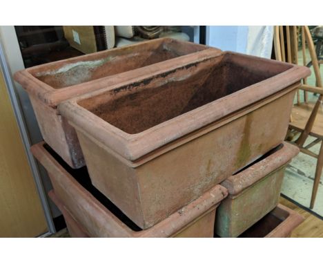 TROUGH PLANTERS, a pair, 76cm x 50cm x 33cm, terracotta, each with loose claw feet. (2) 