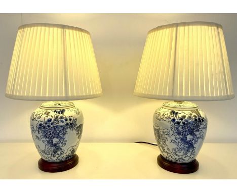 TABLE LAMPS, a pair, Chinese export style blue and white ceramic , with shades, 51x35. (2) 