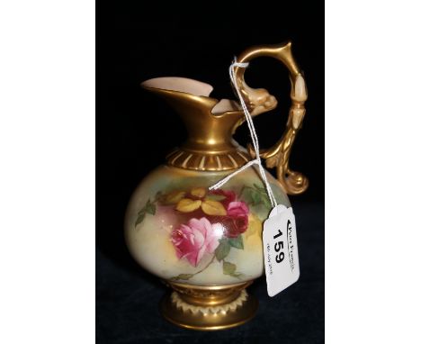 Royal Worcester porcelain jug/ewer, hand painted with roses within gilt boarders.  Printed puce marks to base.  Shape number 