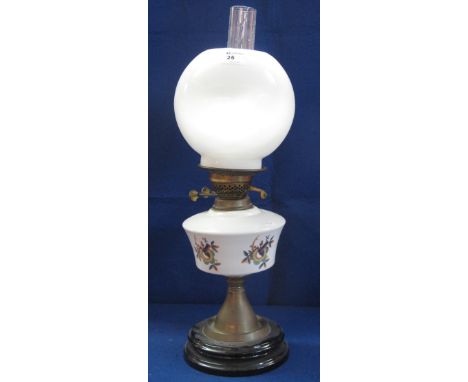 20th Century brass oil lamp with cream reservoir raised on circular stepped base with cream shade and clear glass funnel.