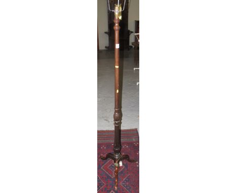 Stained mahogany tripod standard lamp.