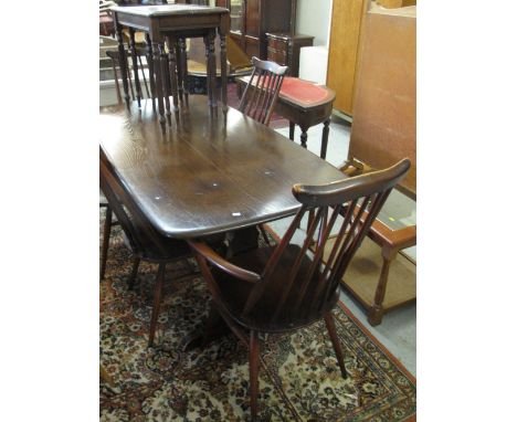 Ercol style refectory table together with six ercol style spindle back kitchen chairs.  (4+2) (7)