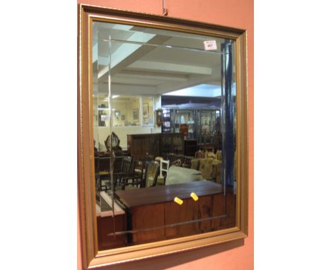 Modern bevel plated mirror with gilt frame.