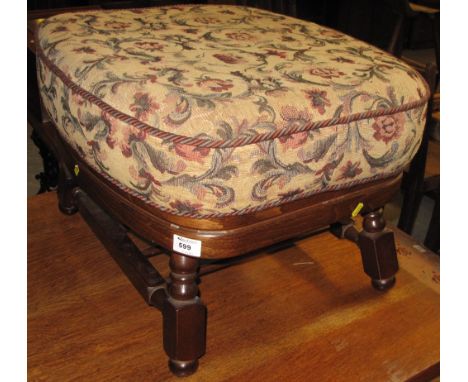 Modern mahogany floral upholstered stool.