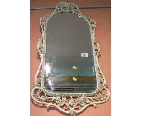 Modern painted, bevel, arch top mirror with floral frame.