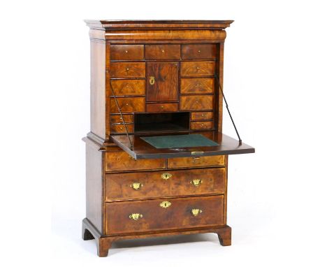 Queen Anne walnut secretaire, circa 1710, the secretaire top having an ovolu fronted long drawer beneath an ogee moulded corn