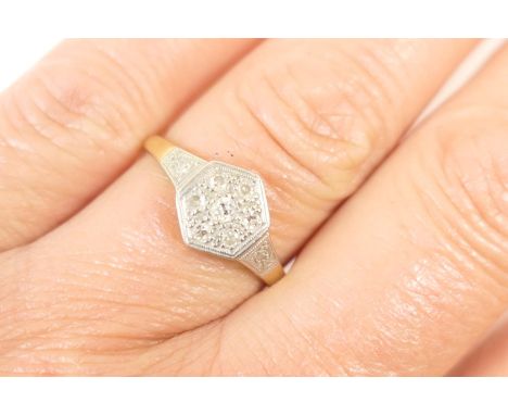 Diamond cluster ring, set with seven small round brilliant cut diamonds in a hexagonal millegrain setting, the shoulders also