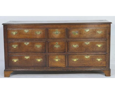Oak mule chest, in part 18th Century with later additions, having a hinged top with three faux drawer front over a configurat