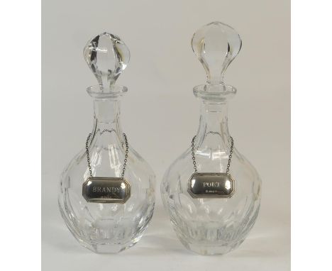 Pair of modern crystal glass decanters, of mallet form, each with conforming stopper and with sterling silver decanter collar