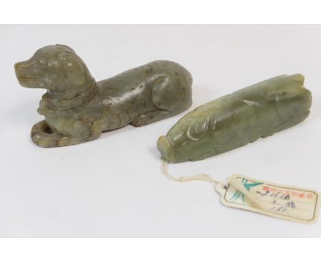 Chinese carved celadon jade figure of a recumbent dog, 9.5cm; also a carved jadeite pendant worked as a pig, 8.5cm (2) (Viewi