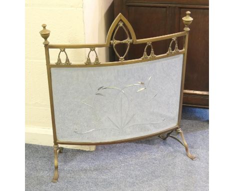 Edwardian brass and mirrored firescreen, bowed shape surmounted with finials and with cut linear decoration, width 80cm, heig