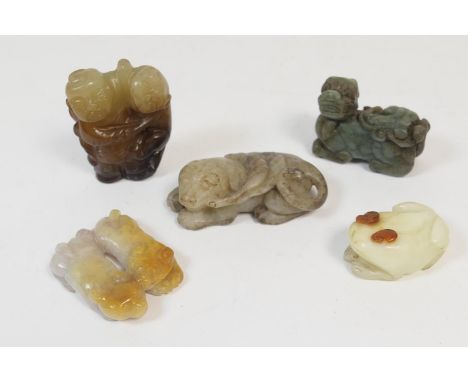 Five Chinese carved jade items including a celadon dog, 7cm; pair of puppies in yellow jade, 5cm; frog in white jade with ter