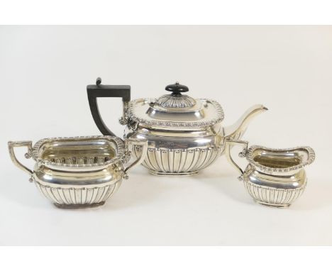 Edwardian silver bachelor's three piece tea service, maker William Neale &amp; Son, Chester 1902 and 1906, of fluted reeded b