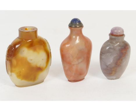 Three Chinese hardstone snuff bottles, including agate bottle with carved lion's mask ring handles, 6.5cm; a blueish moss aga