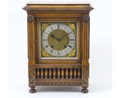 German oak chiming mantel clock, circa 1890, brass dial with matted centre, silvered chapter ring, the movement signed 'Lenzk