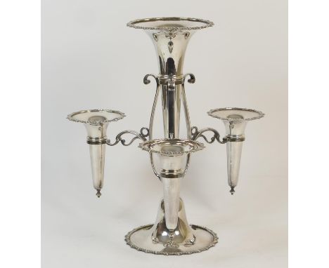 Electroplated table epergne, circa 1900, having a central trumpet with gadrooned edge and three smaller trumpets suspended fr