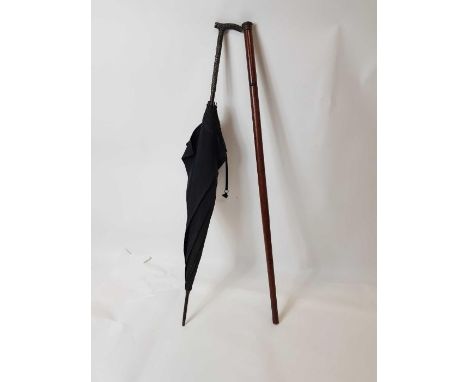 A Victorian umbrella with chased silver metal handle together with a reproduction "tippling" walking stick