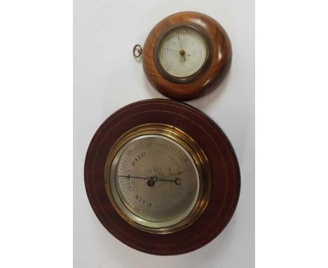 A 20th century aneroid barometer by Negretti &amp; Zambra in circular mahogany case, 21cms diameter, together with a smaller 