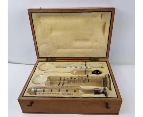 Feser - a vintage cased set of glass instruments to include a lactoscop, cremometer and thermometer, 30.7cm x 20.6cm x 9.9cm 