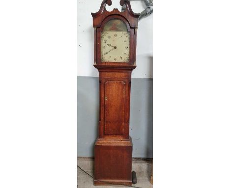 A George III 30 hour longcase clock having arched painted dial and in oak case, the hood with swans neck pediment and pillars