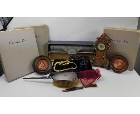 Three vintage card Christian Dior boxes, a silver plated hairbrush, a string of graduated ivory beads, mother of pearl counte