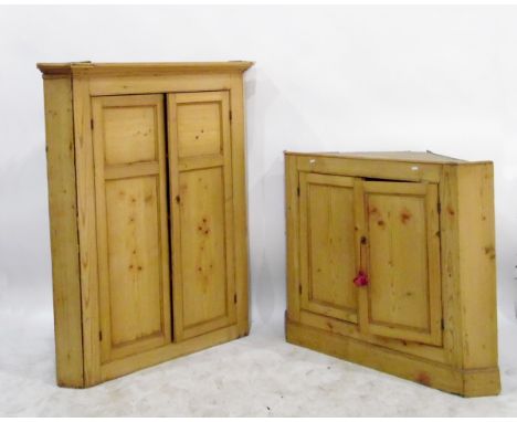 19th century pine standing corner cupboard in two sections, the upper section with flat moulded cornice over two panelled doo