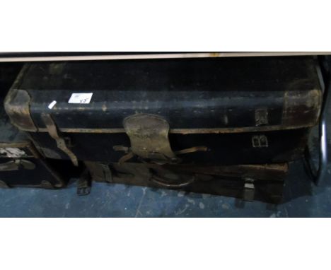 Three various canvas and leather travelling trunks, a large leather case&nbsp;and&nbsp;a tin travelling trunk&nbsp;