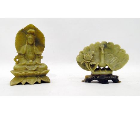 Carved jade figure of a seated deity, 11cm high and a carved jade model of a peacock with flower, on pierced base, 8cm high (