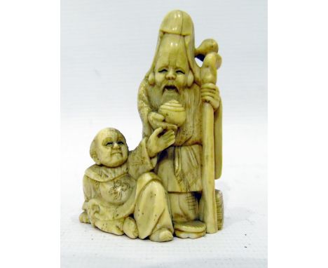 Japanese carved ivory netsuke, carved with sage holding staff and another seated figure