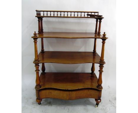 Victorian four-tier buffet&nbsp;of serpentine outline, having turned spindle gallery to superstructure, turned supports, fitt