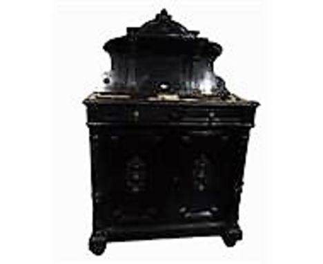 19th century continental ebonised wood side cabinet with carved arched top, shelf back, the cabinet with two short drawers ab