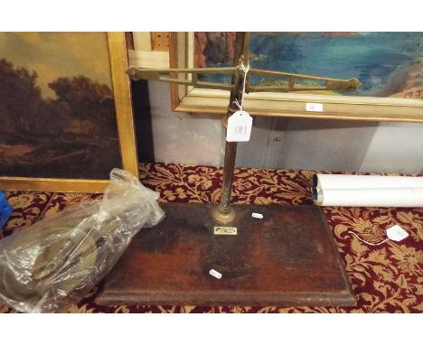 A set of late Victorian Young & Son & Marlow brass scales on a mahogany base