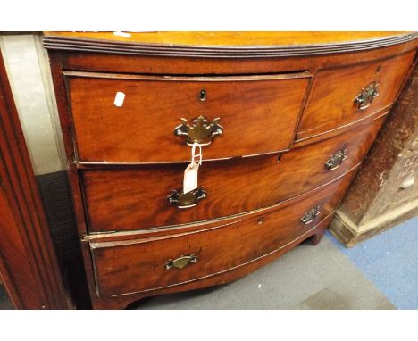 A late Georgian mahogany bow fronted chest of two over two long cock-beaded drawers each with ornate brass swan neck handles 