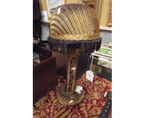 A Lloyd Loom lamp with Lloyd Loom shade in gold colourway