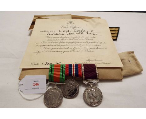 A WWII medal group comprising 1939-45 Defence and War medal, an Elizabeth II Long Service and Good Conduct with regular Army 