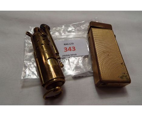 A gold plated Dunhill lighter No.1657352, together with a brass petrol lighter