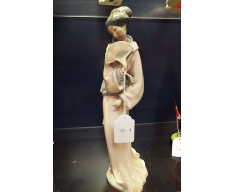 A Nao figurine of a geisha girl with a fan