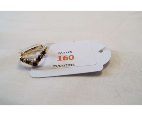 A 9ct gold wishbone ring set with sapphires and diamonds, size M