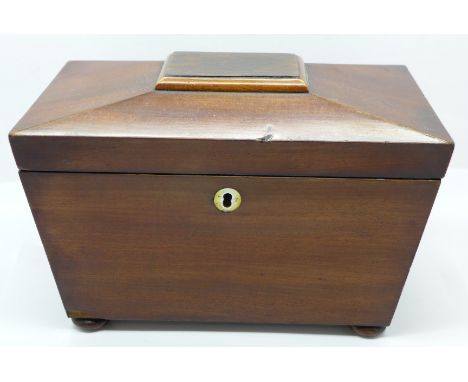 A mahogany sarcophagus shaped tea caddy